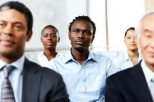 Business associates sitting attentively at seminar